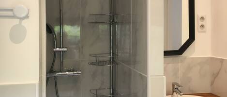 Shower, hair dryer, towels, toilet paper