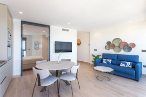 Premium Apartment, 1 Bedroom, Terrace, Sea View | Living area | 50-inch Smart TV with digital channels, TV - Arenal Suites Benidorm (Benidorm)