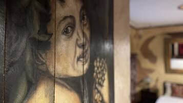 A close-up of a wall with a mural.