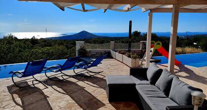 New villa with 2 pools & perfect sea view on a quiet green hill 5 min from beach