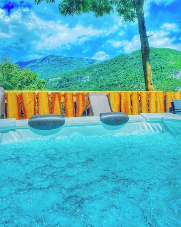 Outdoor spa tub. Chalet Torcel Romantic Spa & Nature
