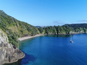 Escape to a serene coastal haven with breathtaking sea views and lush green hills, perfect for sailing and relaxation.