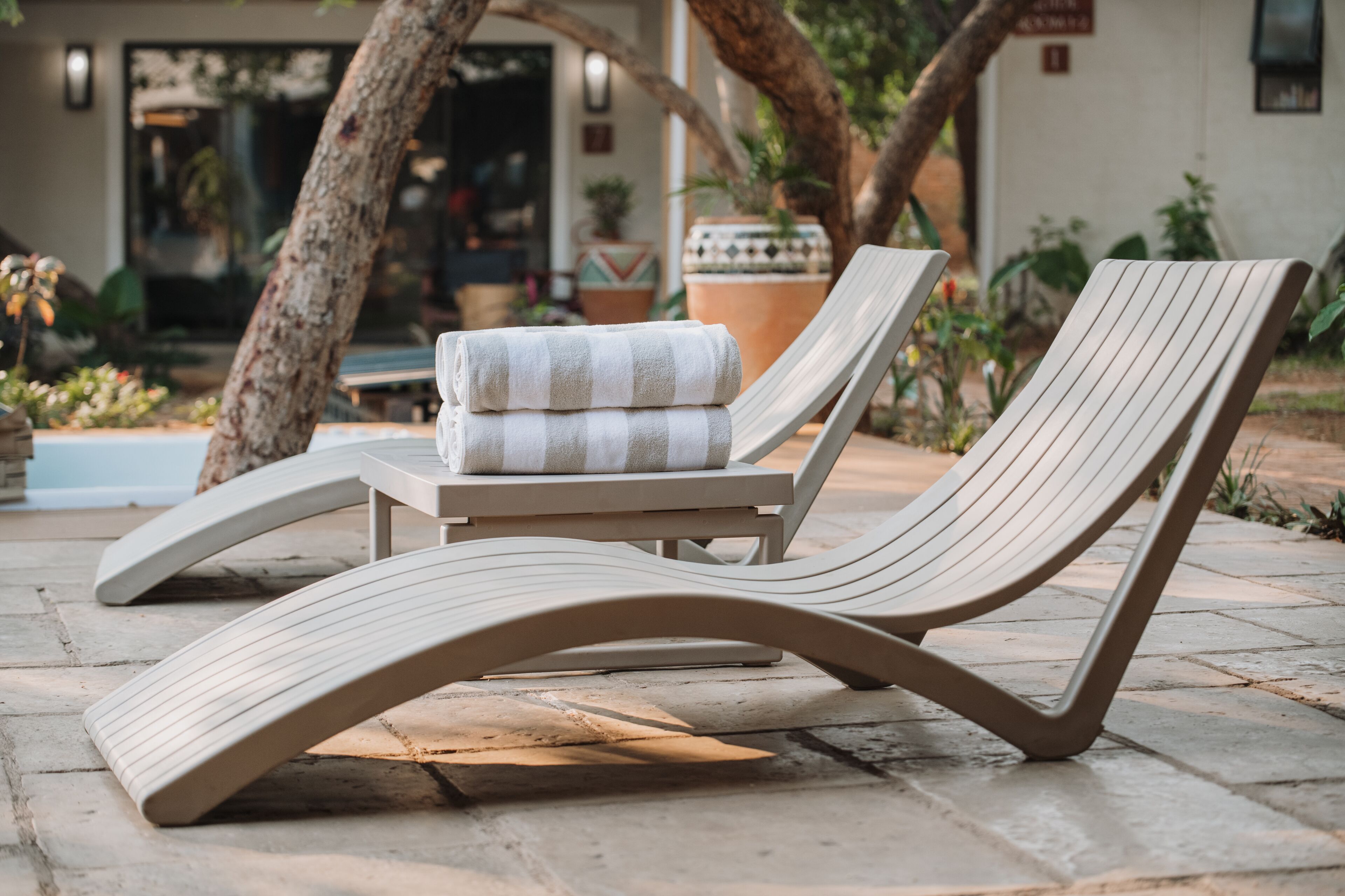 Outdoor pool, pool umbrellas, sun loungers