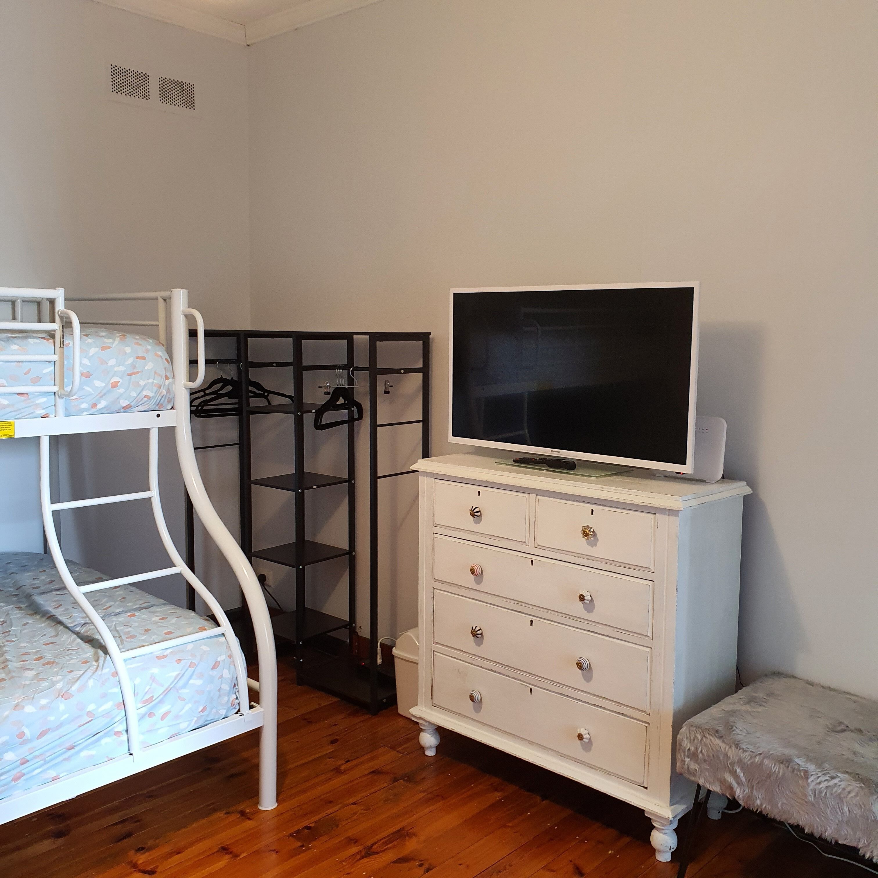 3rd bedroom with double bunk and a single over it