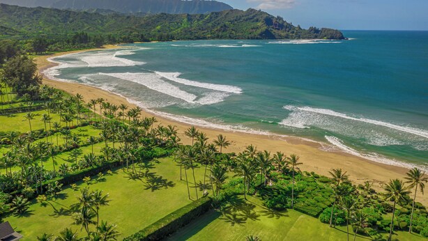 A coastal landscape with a beach, lush greenery, and a mountainous backdrop. - Private Hanalei house, close to the beach and town! TVNC 1298 (Hanalei)