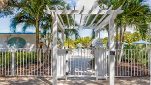 Enter a serene tropical oasis through this beautifully landscaped entrance.