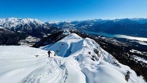 A snowy mountain landscape with a clear view of distant mountains and a lake. - Le Balcon Des Ecrins (Reallon)