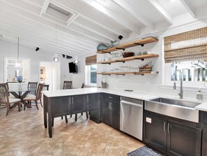 Enjoy meals in the well-lit kitchen with a spacious island and dishwasher.