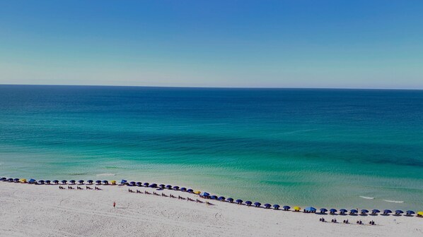 On the beach, sun-loungers