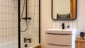 Bathtub, hair dryer, towels