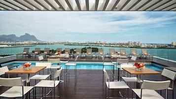 Outdoor pool, open 9:00 AM to 7:00 PM, pool umbrellas, pool loungers