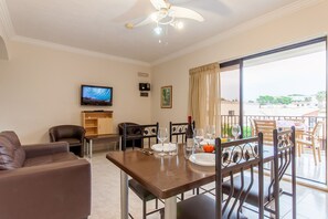 Family Apartment, Multiple Bedrooms (Sunny pool and terrace - Merill nb2) | Living area | 21-inch flat-screen TV with cable channels - Pool and Sea, charming Merill Apart 5 (Mellieha)