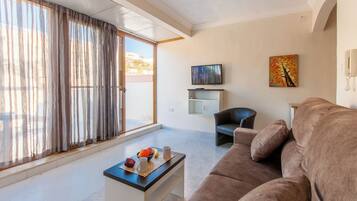 Family Penthouse, Multiple Bedrooms (Sunny pool and terrace - Merill nb6) | Living area | 21-inch flat-screen TV with cable channels