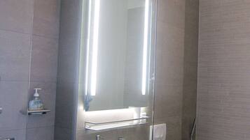 Bathtub, hair dryer, towels, soap