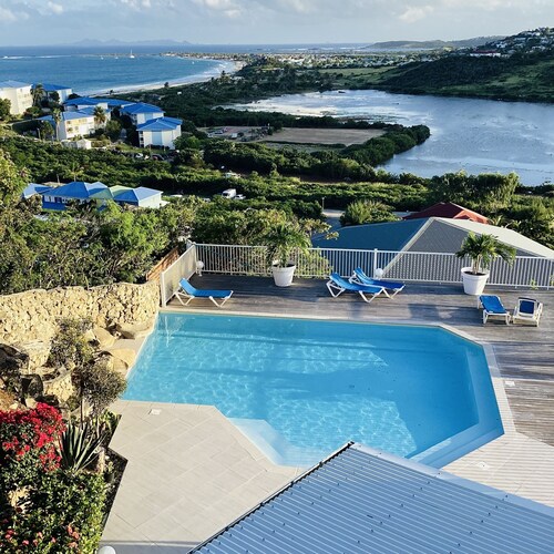 Duplex with frangipani tree, view of Saint Barthelemy, Baie Orientale beach 