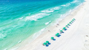 On the beach, sun-loungers