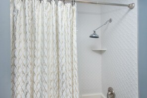 Bathtub, hair dryer, towels, soap