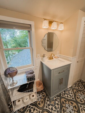 Bathtub, hair dryer, towels, soap