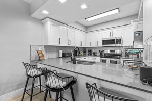 Fridge, microwave, oven, stovetop - Luxury Oceanwalk Condo for Family of 8! High-End Amenities & Estuary Views (New Smyrna Beach)