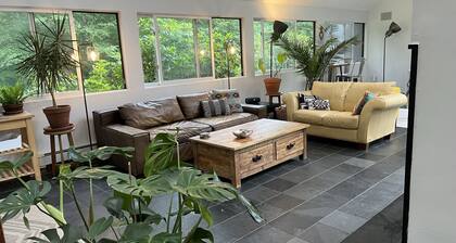 Architectural woodland retreat with trails, sauna, theater