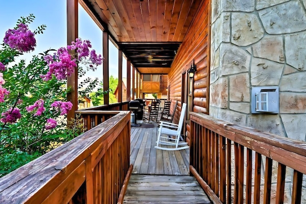 Enjoying the simple pleasures of life in our porch filled with rocking chairs and colorful flowers