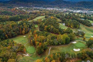 Golfers can enjoy a challenging round amidst a serene wooded landscape.