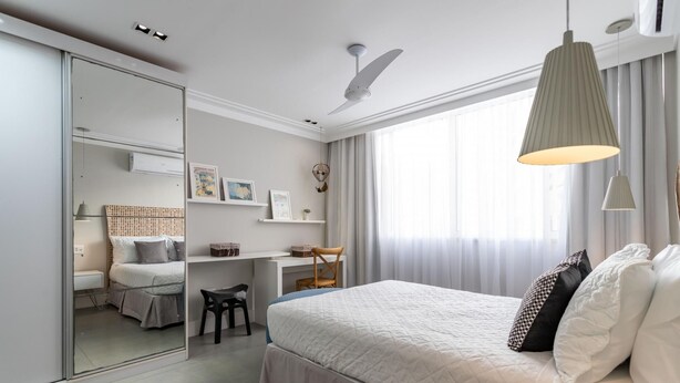 A modern bedroom with a large bed, a desk, and a wardrobe. - Modern in Ipanema Great for Families Re406 Z2 (Rio de Janeiro)