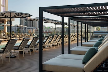 Outdoor pool, sun loungers at Hotel Fraye Nashville, Curio Collection By Hilton