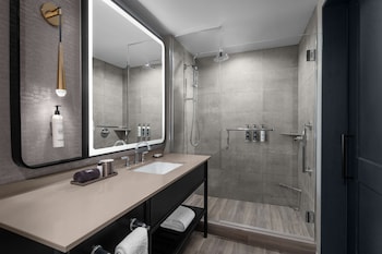 Bathroom shower at Hotel Fraye Nashville, Curio Collection By Hilton
