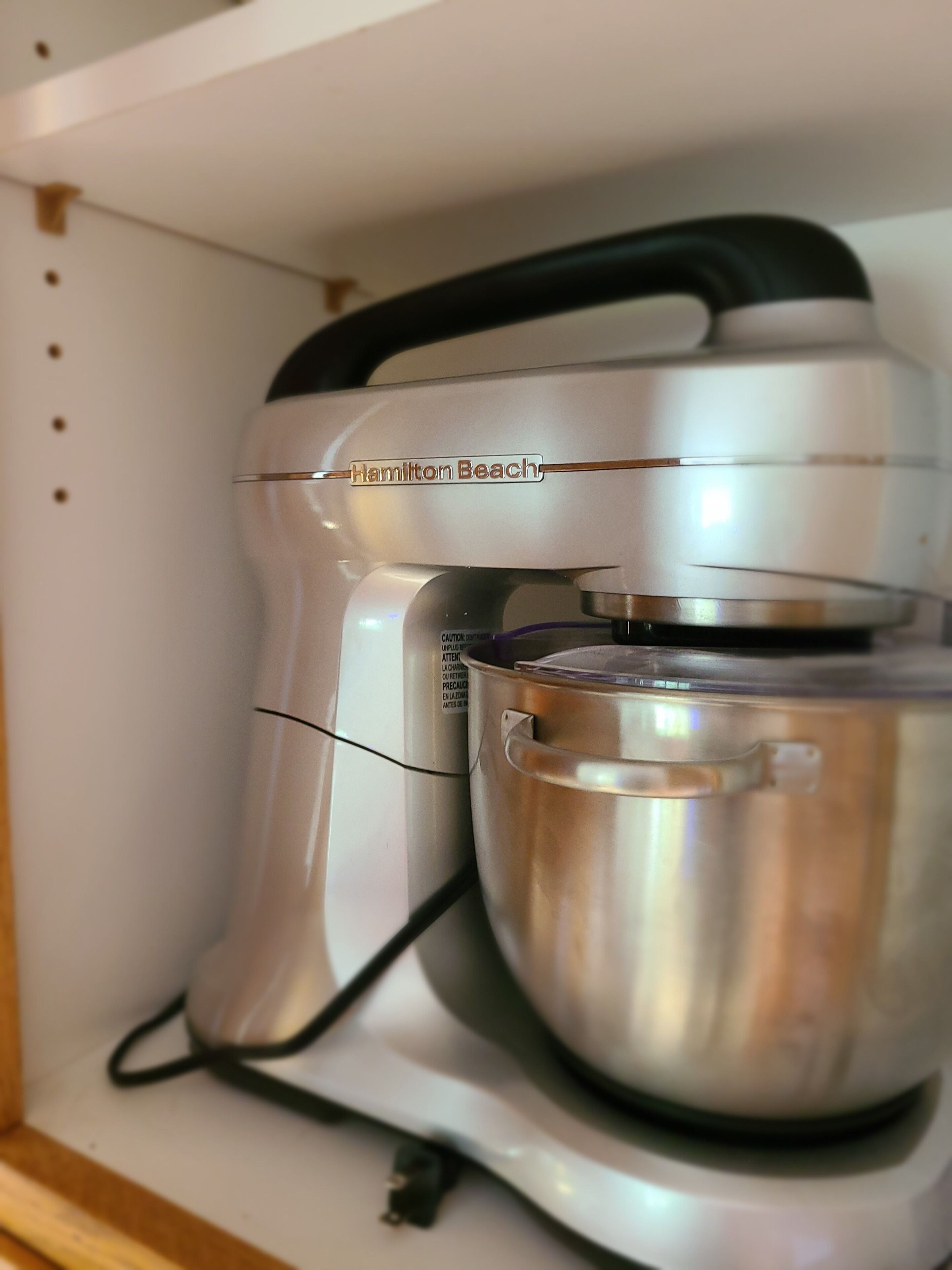 A Hamilton Beach blender on a shelf.