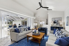 Smart TV, fireplace, books, computer monitors