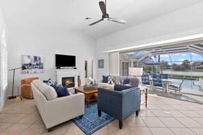 Smart TV, fireplace, books, computer monitors