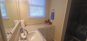 Combined shower/tub, hair dryer, towels, soap