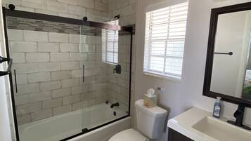 Combined shower/tub, hair dryer, towels, soap