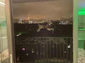 Experience the vibrant cityscape from the comfort of your room.