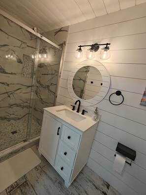 Shower, hair dryer, towels, soap