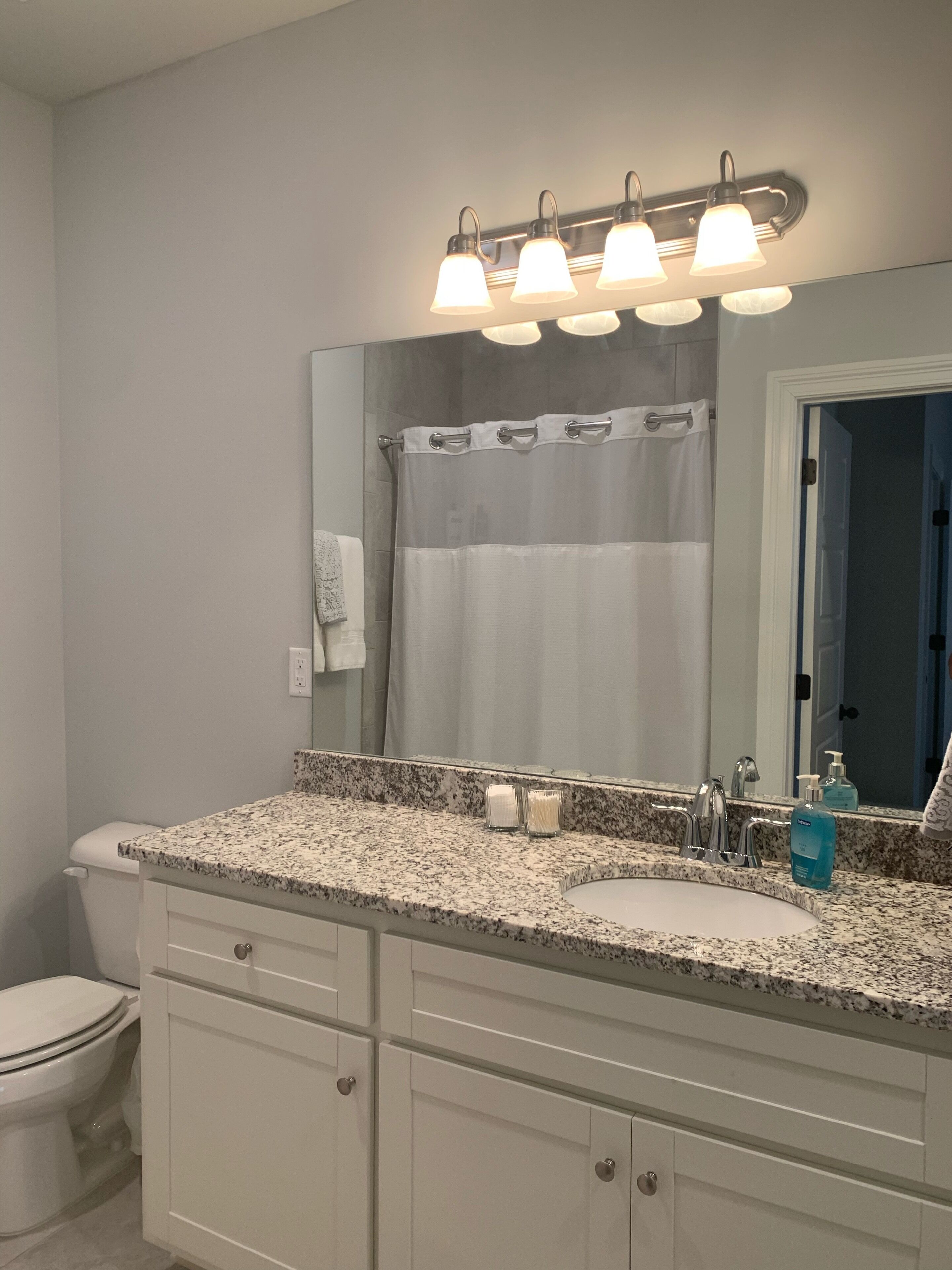 Combined shower/tub, hair dryer, towels, soap