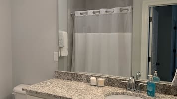 Combined shower/tub, hair dryer, towels, soap