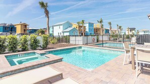 A swimming pool with a 3 FT depth marker, surrounded by a fence, with a view of colorful buildings and palm trees in the background. - Shake Shack Heated Pool & Hot Tub (Kissimmee)
