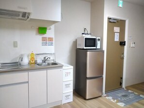 Fridge, microwave, cookware/dishes/utensils