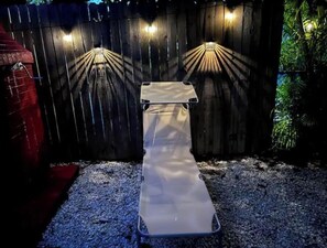 Sit and unwind in a serene garden setting with a comfortable bench.