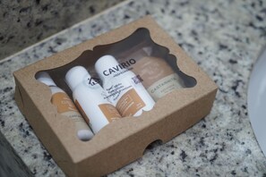 A cardboard box containing three bottles of Castanheira soap.
