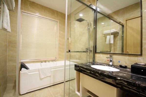 A modern bathroom with a glass-enclosed shower, a white bathtub, and a marble countertop sink. - Phoenix Grand Hotel (Xianyang Yangling) (Xianyang)