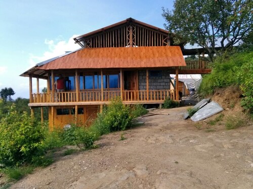 Happy and Peaceful wooden cottage with ample of space in 5 acre of apple orchard