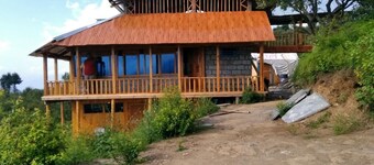 Happy and Peaceful wooden cottage with ample of space in 5 acre of apple orchard