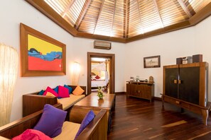 Deluxe Double Room | Living area | 32-inch flat-screen TV with satellite channels, TV - One Myanmar Resort Ngapali (Ngapali)
