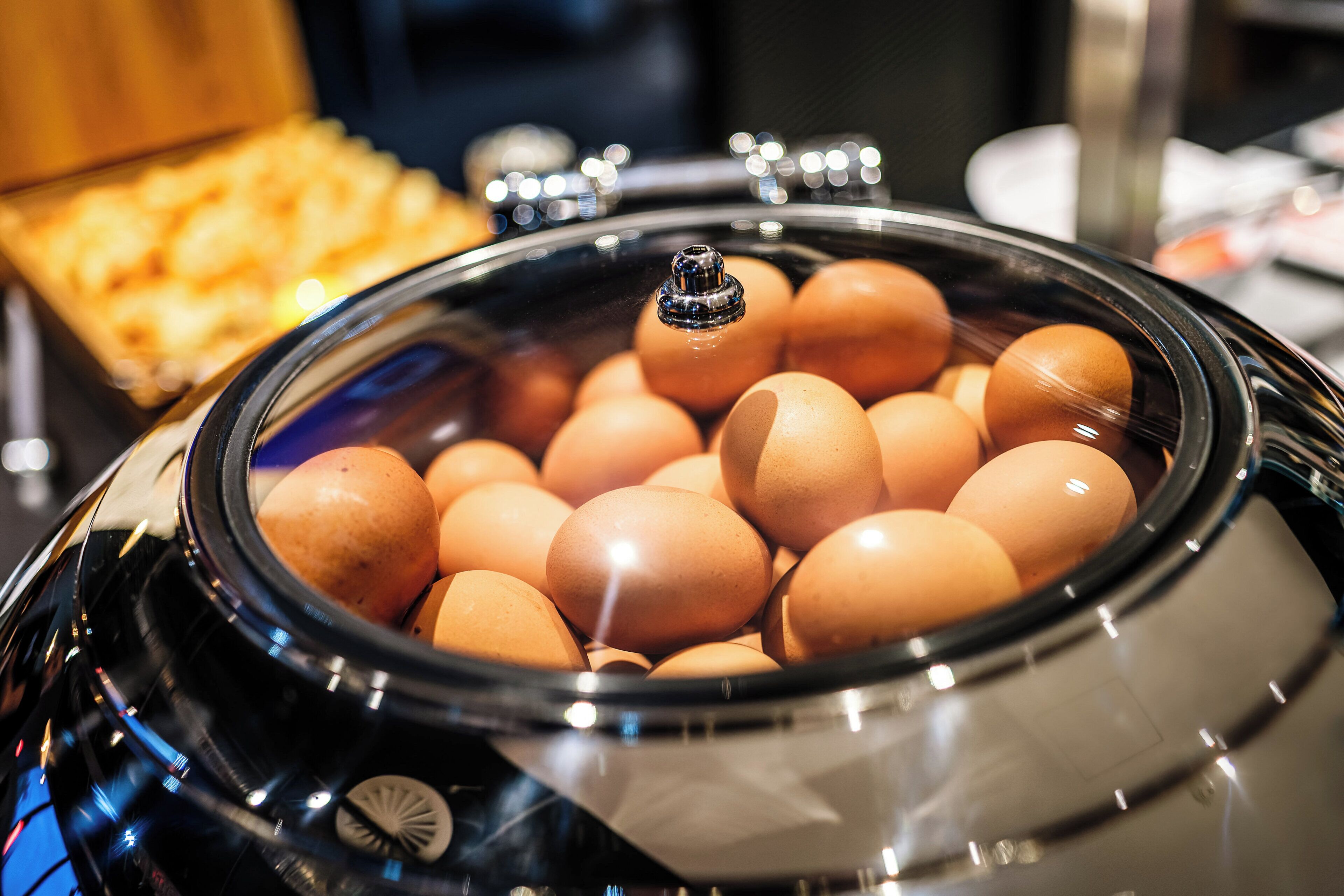 A slow cooker filled with eggs.