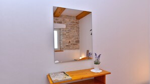 A wooden shelf with a book and a vase with flowers. - House 2176/55604 (Istria - Debeljuhi), 19000m from the beach (Debeljuhi)
