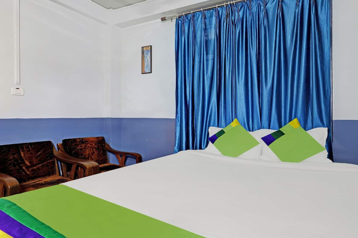 Desk, iron/ironing board, bed sheets