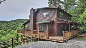 A two-story log cabin with a wooden deck and a covered porch. - Rustic Young Harris Cabin w/ Fire Pit & Views (Young Harris)